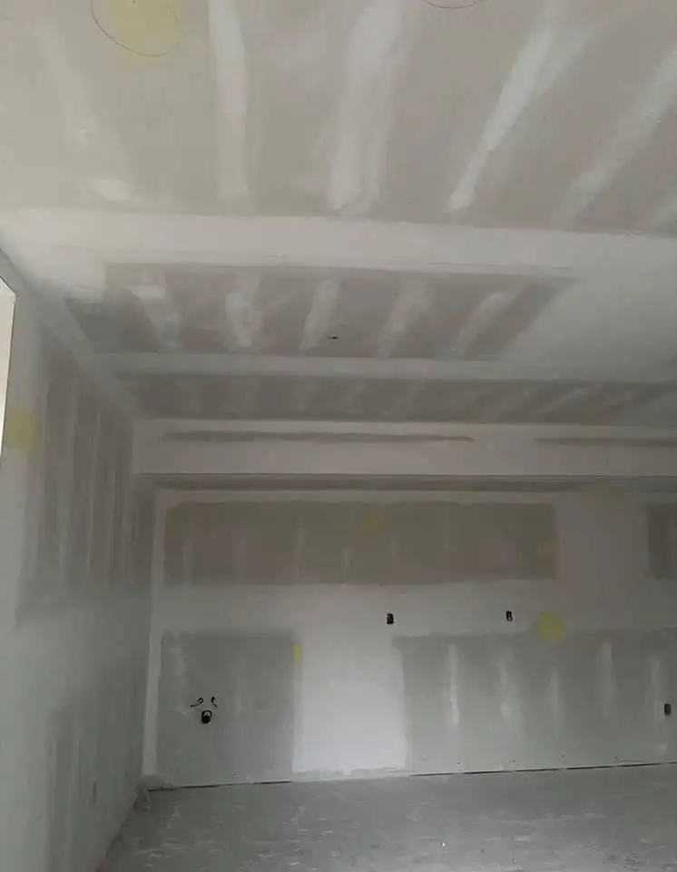Drywall taping on a ceiling
